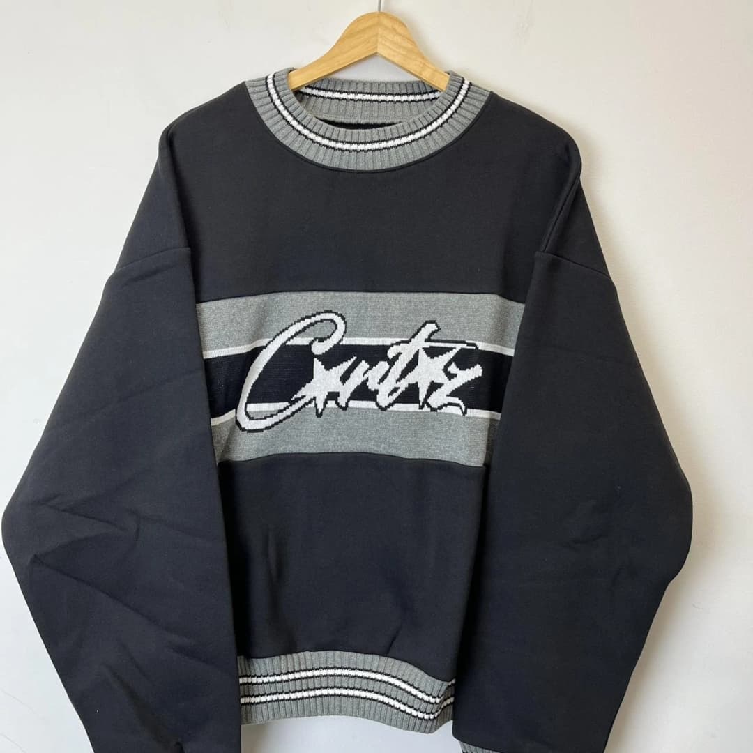 Product Sudadera Corteiz en negro y gris.